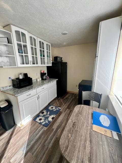 King Kitchenette at Cedarville Hotel — full-size fridge, microwave, coffee station, and dining table